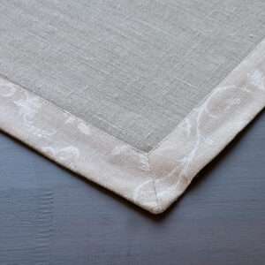 Classic grey linen placemat with flower pattern border.....