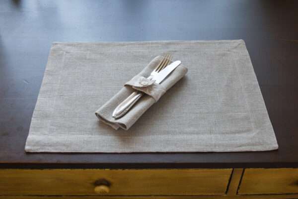 Classic grey linen placemat with flower pattern border. Classic grey linen placemat with flower pattern border.....